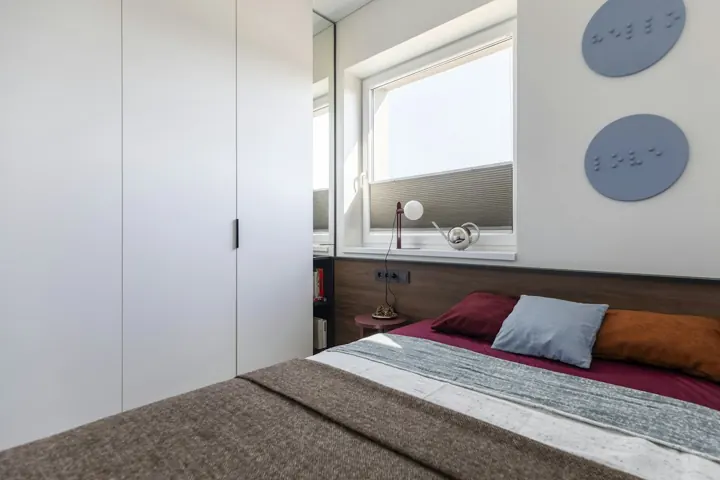 Bedroom with fitted wardrobe and window