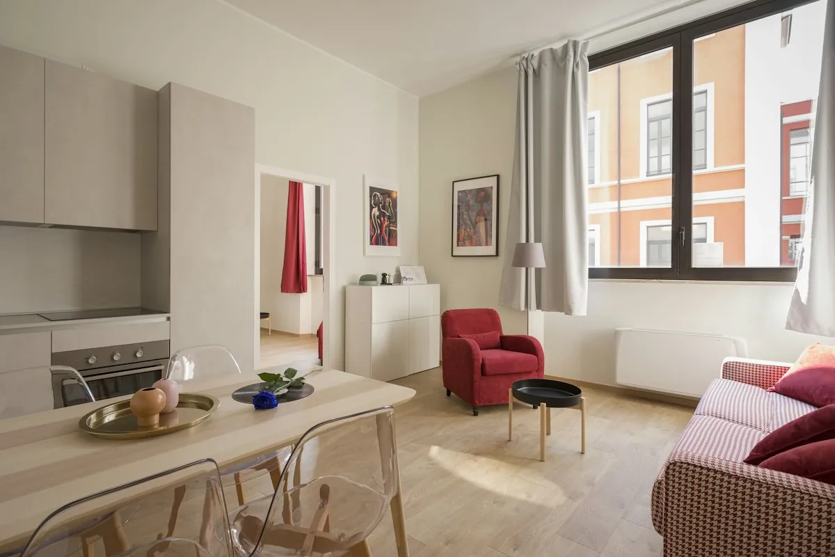 Open-plan furnished apartment with a dining table